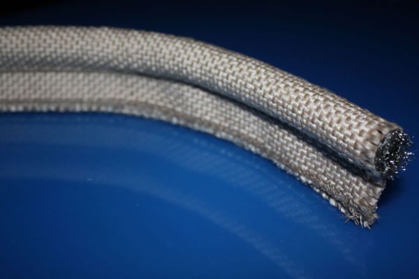 Vermiculite coated fiberglass tadpole gasket tape